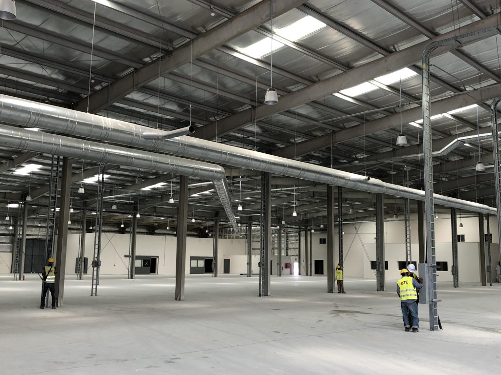 warehouse construction, warehouse construction method statement, steel structure erection, PEB warehouse construction, concrete foundation work, site preparation, excavation and backfilling, anchor bolts installation, base plates alignment, structural steel assembly, roof cladding installation, wall cladding panels, floor concrete finishing, laser screed flooring, vapor barrier installation, quality control in construction, inspection and test plan ITP, safety procedures at site, PPE safety equipment, welding procedure specification WPS, torque test for bolts, concrete cube test, construction sequence, warehouse finishing works, external works construction, stormwater drainage system, warehouse landscaping, project handover documentation, as-built drawings, HSE compliance, Saudi Building Code, ASTM standards, ACI concrete standards, warehouse roofing system, industrial warehouse construction, pre-engineered building erection, construction site management, QA/QC documentation, material testing reports, project safety plan, toolbox talk, warehouse floor curing, construction supervision, DTC warehouse projects, industrial building construction Saudi Arabia